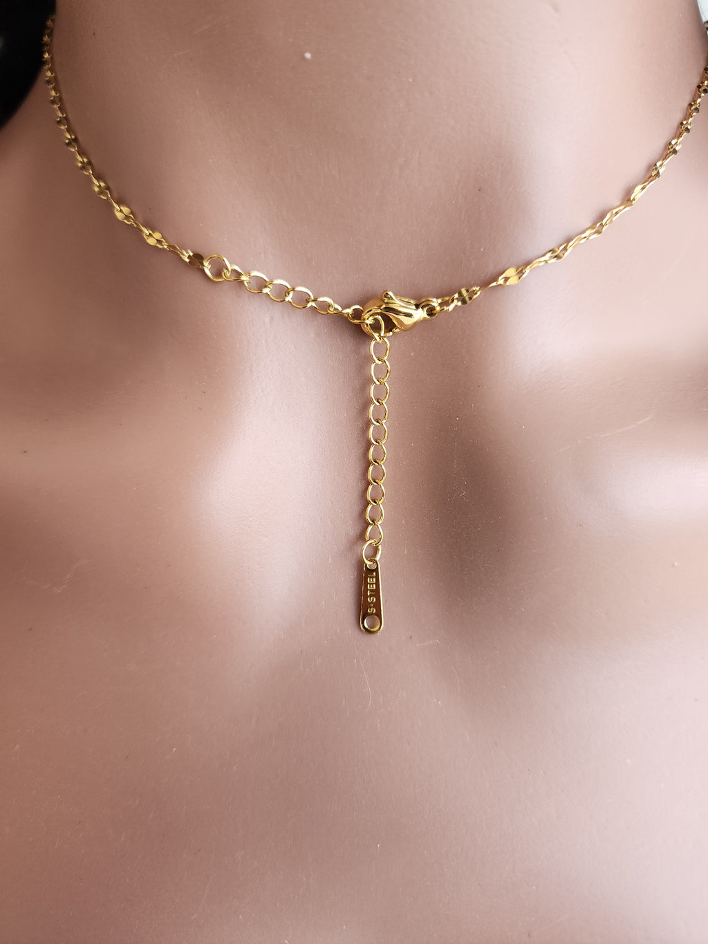 Collier pendentif fleur et strass tournante